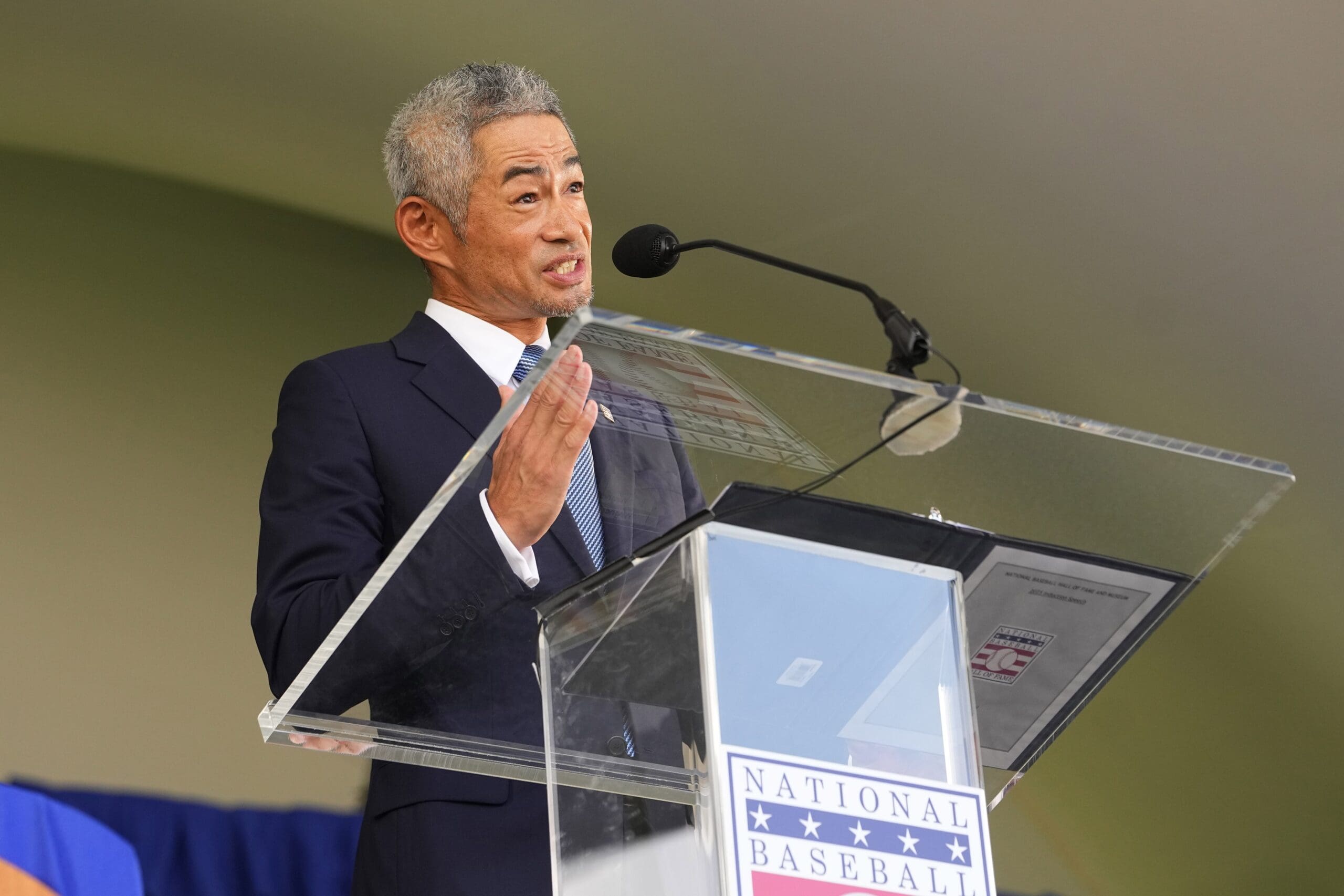 Jul 27, 2025; Cooperstown, NY, USA; Hall of Fame inductee Ichiro Suzuki makes his Baseball Hall of Fame acceptance speech during the Baseball Hall of Fame Induction Ceremony at the Clark Sports Center. Mandatory Credit: Gregory Fisher-Imagn Images