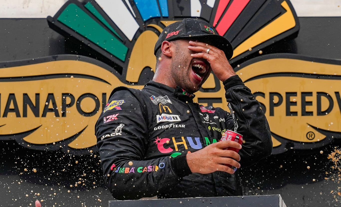 NASCAR Cup Series driver Bubba Wallace (23) celebrates winning Sunday, July 27, 2025, the Brickyard 400 at Indianapolis Motor Speedway.