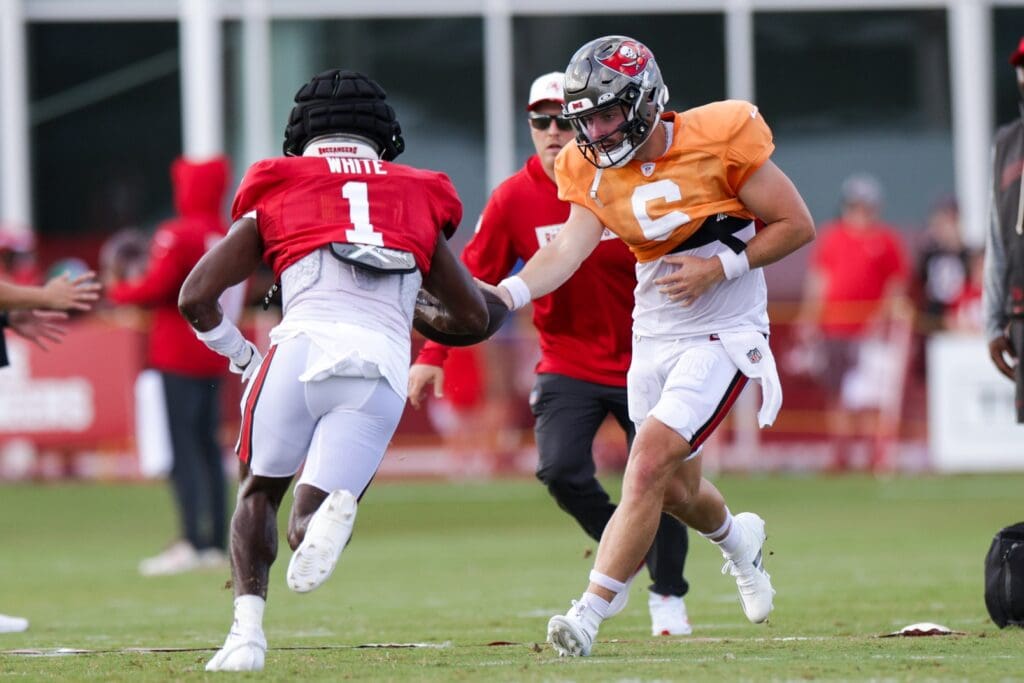 Jul 31, 2025; Tampa, FL, USA; Tampa Bay Buccaneers quarterback Baker Mayfield (6) hands off to running back Rachaad White (1) in training camp at AdventHealth Training Center. Mandatory Credit: Nathan Ray Seebeck-Imagn Images