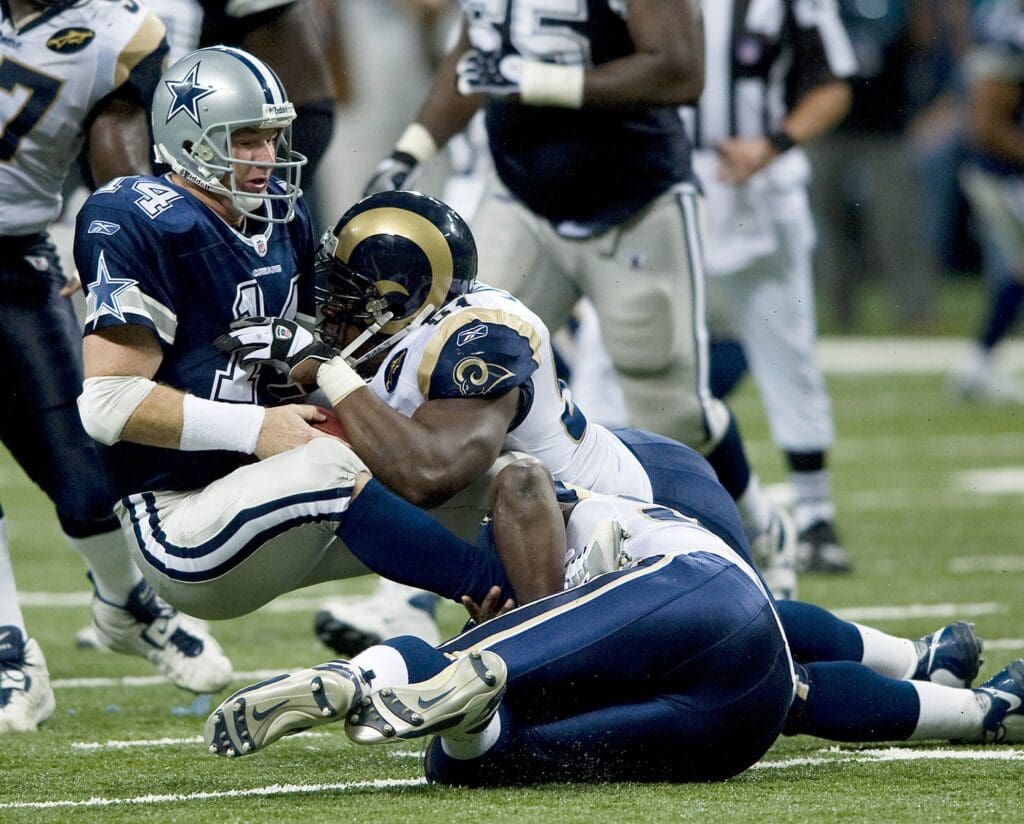 Oct 19, 2008; St. Louis, MO, USA; Dallas Cowboys quarterback Brad Johnson (14) is sacked by St. Louis Rams defensive end James Hall (96) and Rams defensive end Leonard Little (91) in the second half at the Edward Jones Dome. The Rams defeated the Cowboys 34-14. Mandatory Credit: Photo by Scott Rovak-USA TODAY Sports