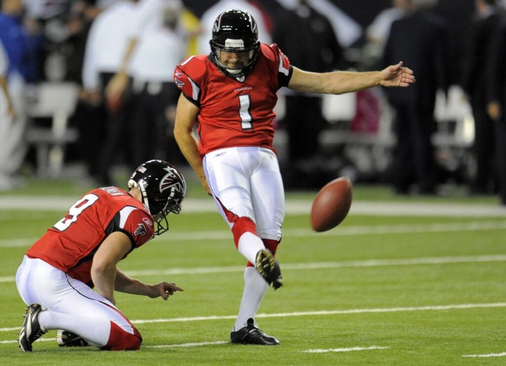 October 18, 2009; Atlanta, GA, USA; Atlanta Falcons placekicker Jason Elam (1) kicks from the hold of punter Michael Koenen (9) prior to the game against the Chicago Bears at the Georgia Dome. Mandatory Credit: Dale Zanine-USA TODAY Sports