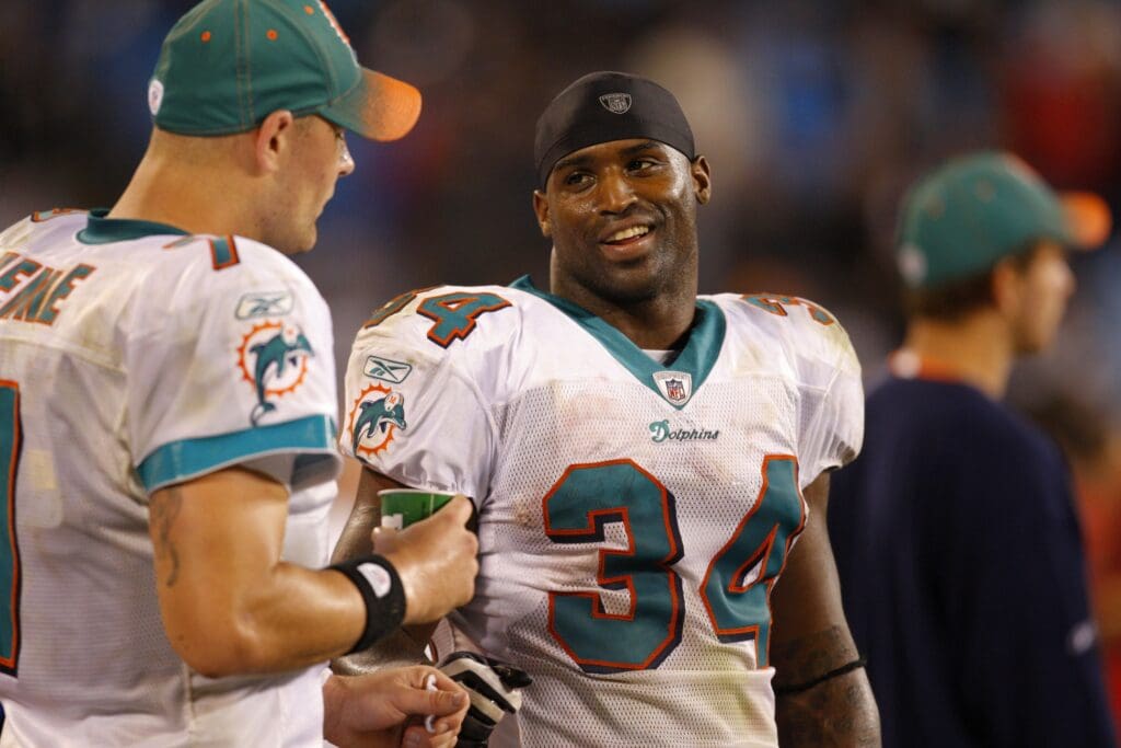 Nov 19, 2009; Charlotte, NC, USA; Miami Dolphins running back Ricky Williams (34) and quarterback Chad Henne (7) react toward the end of the game at Bank of America Stadium. The Dolphins defeated the Carolina Panthers 24-17. Mandatory Credit: Bob Donnan-USA TODAY Sports