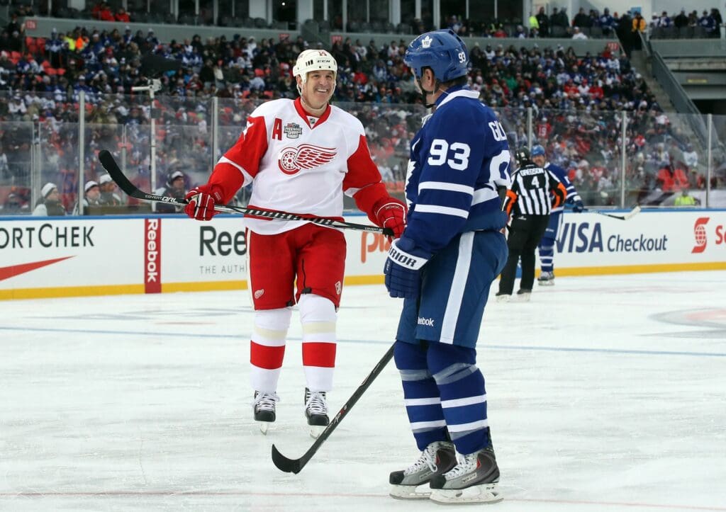 Dec 31, 2016; Toronto, ON, Canada; Detroit Red Wings forward Brendan Shanahan (14) shares a laugh with Toronto Maple Leafs forward Doug Gilmour (93) during the 2017 Rogers NHL Centennial Classic Alumni Game at BMO Field. The Red Wings beat the Maple Leafs 4-3. Mandatory Credit: Tom Szczerbowski-USA TODAY Sports
