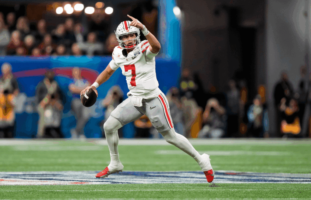 Dec 31, 2022; Atlanta, Georgia, USA; Ohio State Buckeyes quarterback C.J. Stroud (7) runs away from the pocket to throw a touchdown pass to Ohio State Buckeyes wide receiver Marvin Harrison Jr. (18), not in photo, against Georgia Bulldogs during the first quarter of the Peach Bowl in the College Football Playoff semifinal at Mercedes-Benz Stadium. Osu22uga Kwr 16 Syndication The Columbus Dispatch