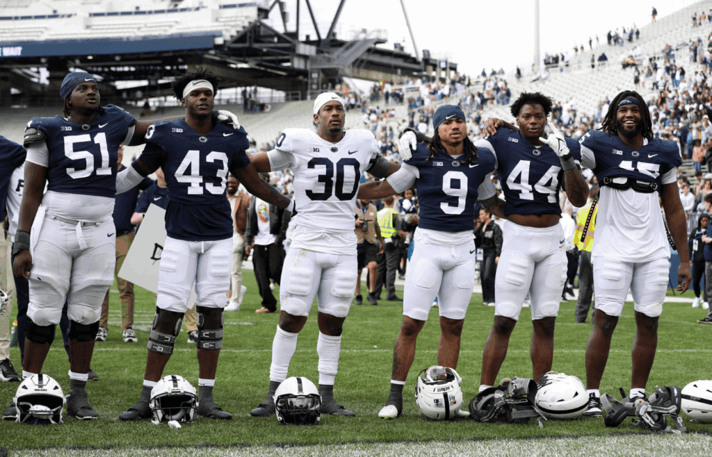 Apr 26, 2025; University Park, PA, USA; The Penn State Nittany Lion players sing their alma mater following the Blue White spring game at Beaver Stadium. The White team defeated the Blue team 10-8. Mandatory Credit: Matthew O'Haren-Imagn Images