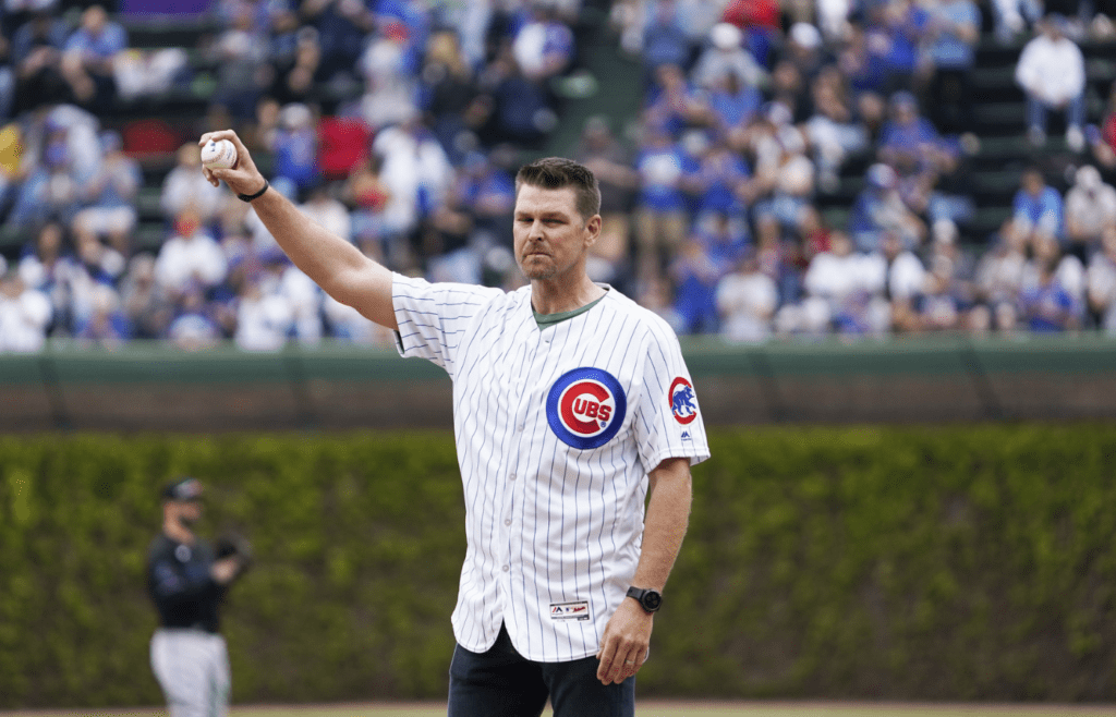 May 6, 2023; Chicago, Illinois, USA; Former Chicago Cubs pitcher Kerry Wood throws out a ceremonial first pitch on the twenty year anniversary of his twenty strike out game against the Houston Astros. at Wrigley Field. Mandatory Credit: David Banks-Imagn Images