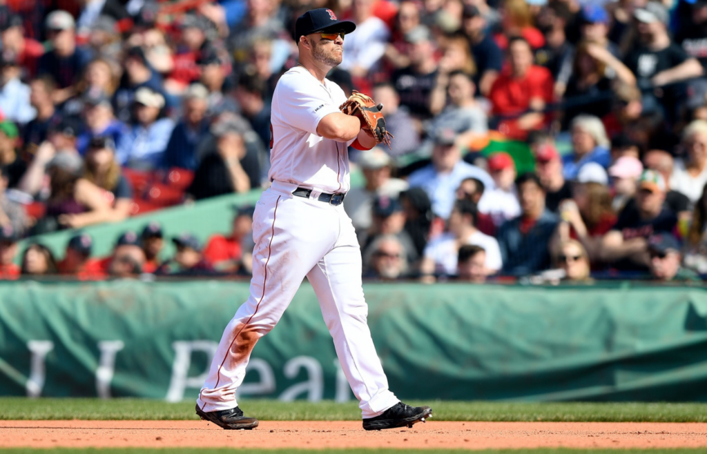 Apr 13, 2019; Boston, MA, USA; Boston Red Sox second baseman Dustin Pedroia (15) reacts after an error during the seventh inning against the Baltimore Orioles at Fenway Park. Mandatory Credit: Brian Fluharty-Imagn Images