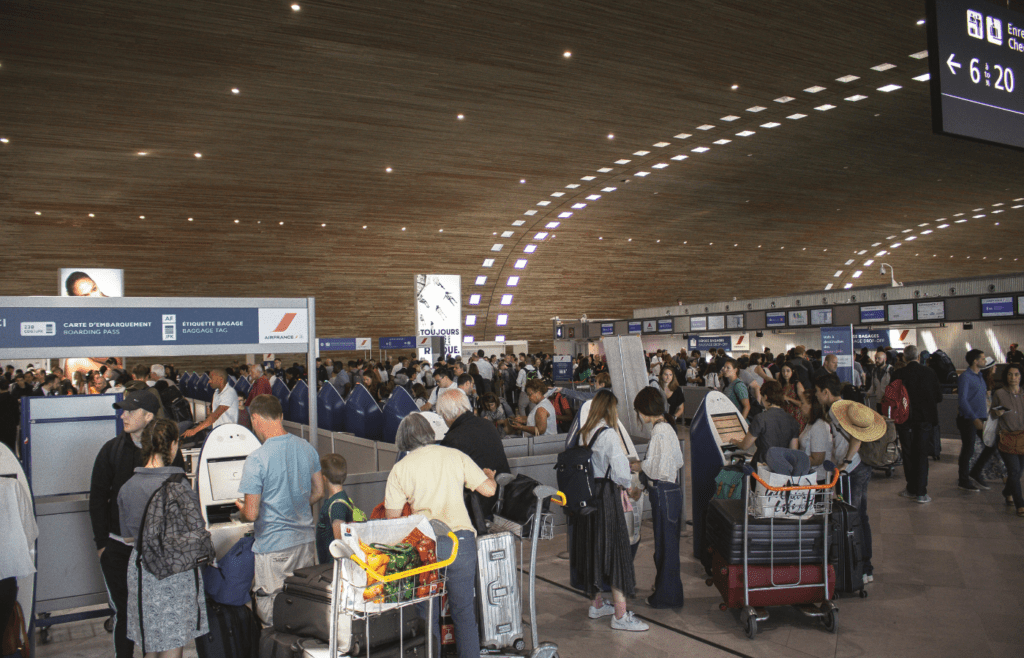 Busy terminal with families greeting loved ones