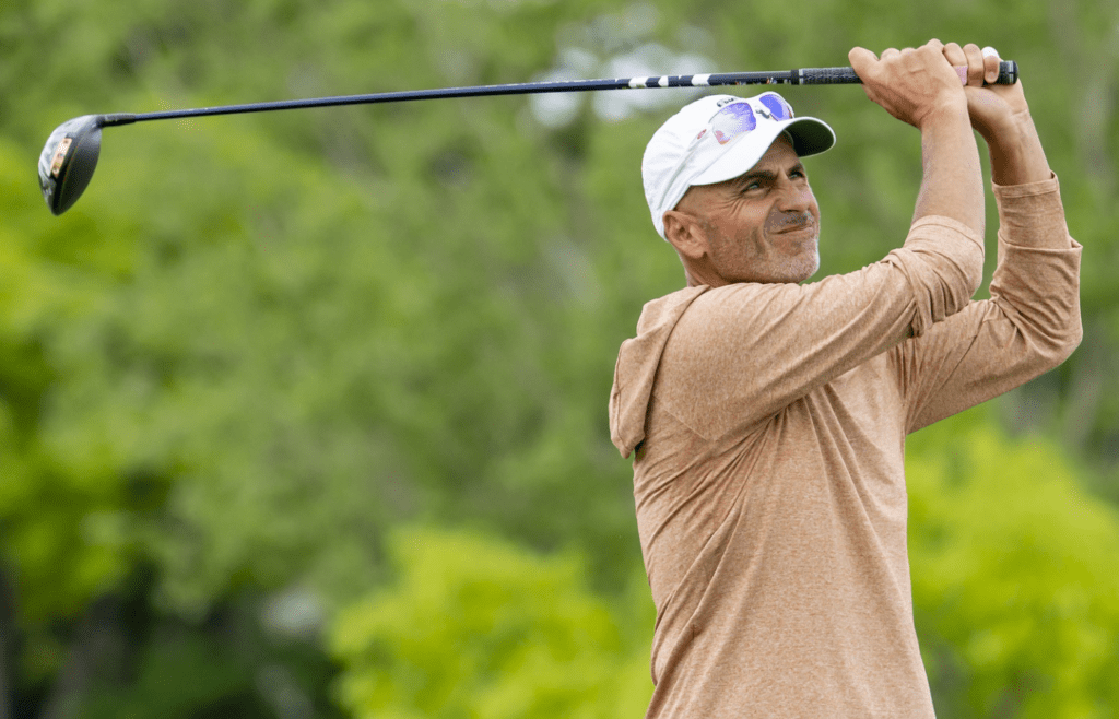 May 26, 2022; Benton Harbor, Michigan, USA; Rocco Mediate hits his tee shot on the eighth hole during the first round of the 2022 KitchenAid Senior PGA Championship at Harbor Shores. Mandatory Credit: Raj Mehta-Imagn Images