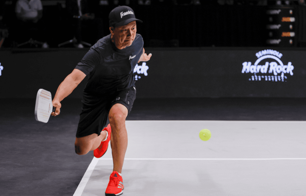 Apr 2, 2023; Hollywood, FL, USA; Michael Chang returns a shot against Andy Roddick (not pictured) during a singles match at the Pickleball Slam at Hard Rock Live at Seminole Hard Rock Hotel & Casino. Mandatory Credit: Sam Navarro-Imagn Images
