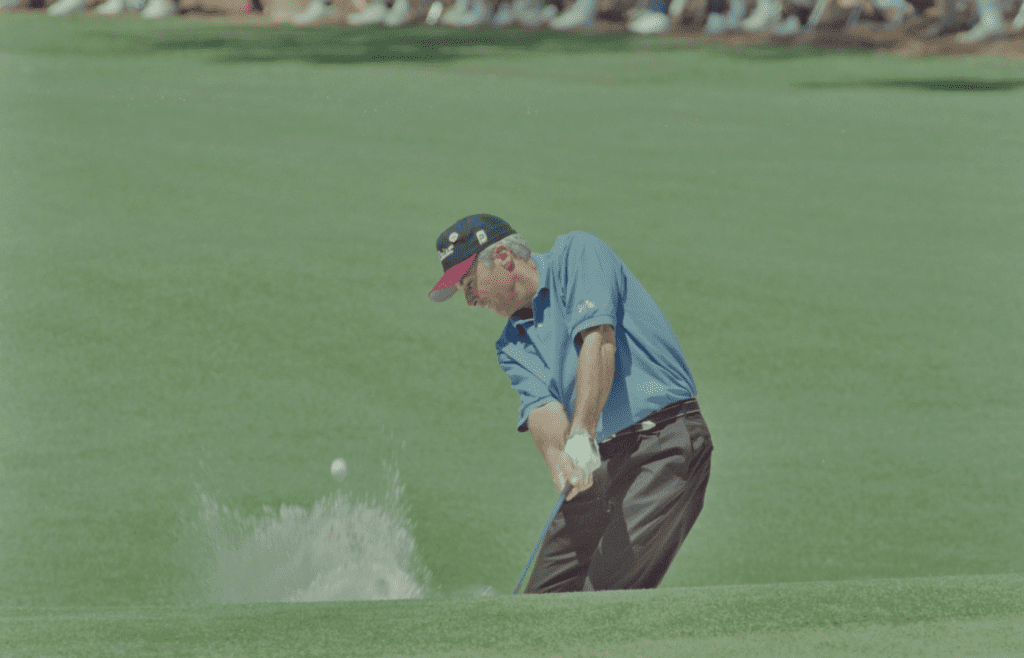 04/14/1995; Augusta, Georgia, USA; Curtis Strange chips the ball out of bunker toward the green at the Augusta National Golf Course during the 1995 Masters. Mandatory Credit: File Photo -The Augusta Chronicle via USA TODAY NETWORK
