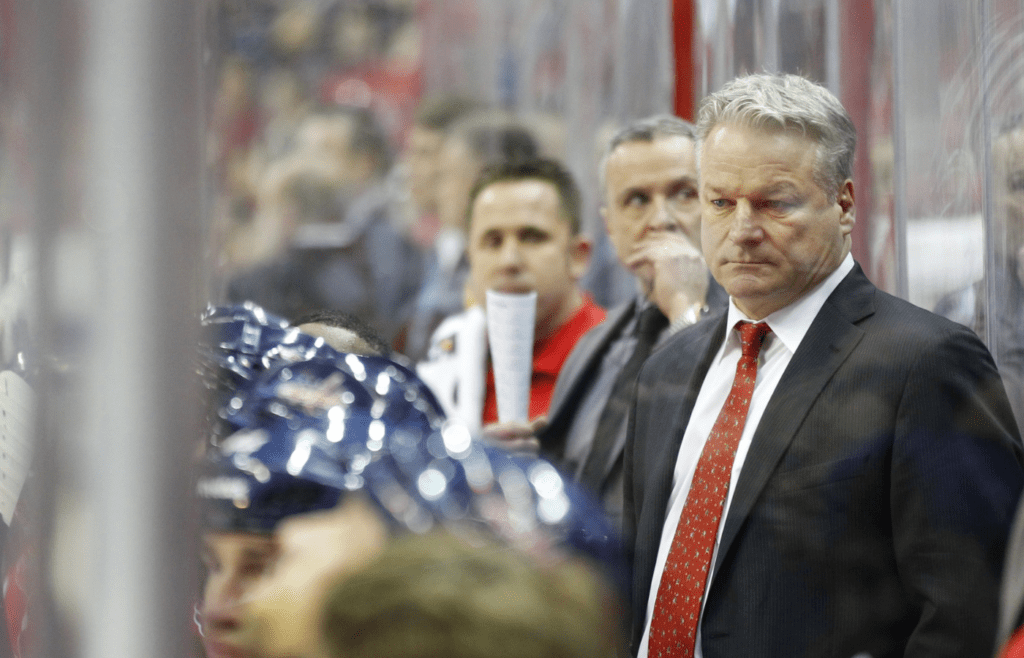 December 20, 2011; Washington, DC, USA; Washington Capitals head coach Dale Hunter watches from behind the bench against the Nashville Predators in the second period at Verizon Center. The Capitals won 4-1. Mandatory Credit: Geoff Burke-Imagn Images