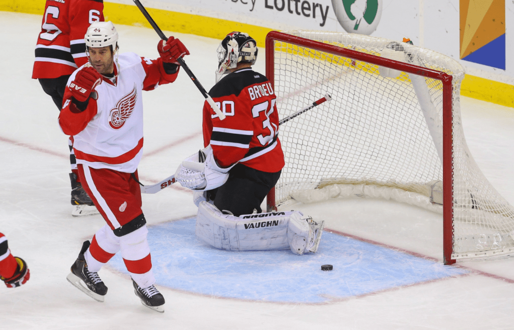 Mar 4, 2014; Newark, NJ, USA; Detroit Red Wings right wing Todd Bertuzzi (44) celebrates his goal on New Jersey Devils goalie Martin Brodeur (30) during the third period at Prudential Center. The Devils defeated the Red Wings 4-3. Mandatory Credit: Ed Mulholland-Imagn Images