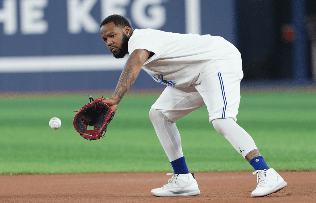 Jun 30, 2025; Toronto, Ontario, CAN; Toronto Blue Jays first baseman Vladimir Guerrero Jr. (27) fields the ball during batting practice before a game against the New York Yankees at Rogers Centre. Mandatory Credit: Nick Turchiaro-Imagn Images