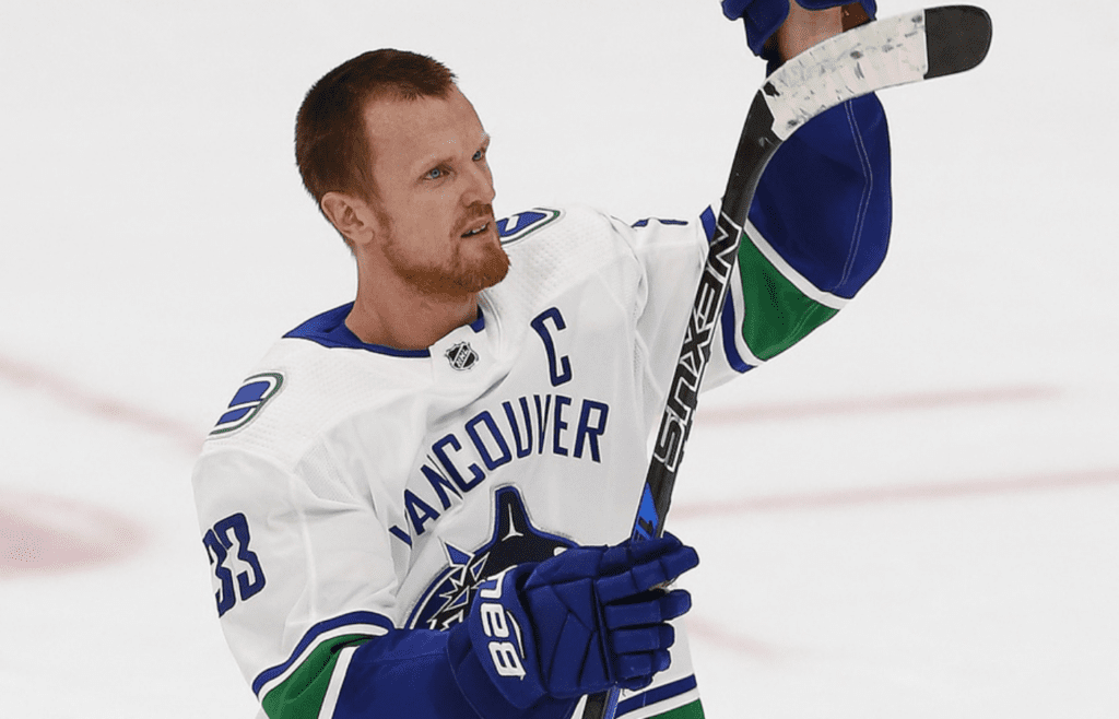 Apr 7, 2018; Edmonton, Alberta, CAN; Vancouver Canucks forward Henrik Sedin (33) waves to Edmonton Oilers fans after his last NHL game at Rogers Place. Mandatory Credit: Perry Nelson-Imagn Images