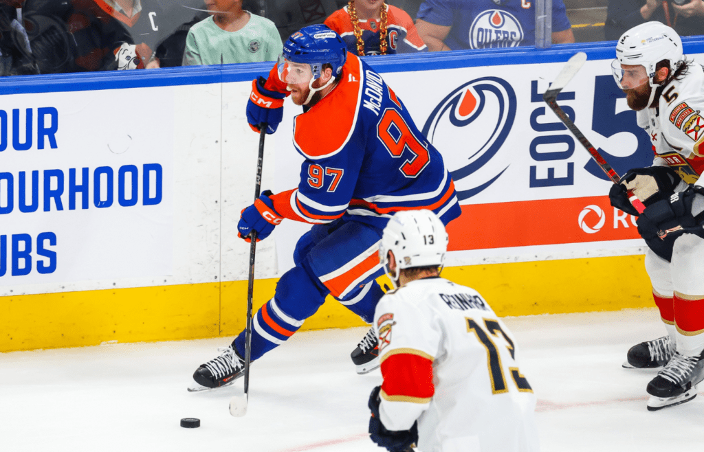 Jun 14, 2025; Edmonton, Alberta, CAN; Edmonton Oilers center Connor McDavid (97) skates with the puck against the Florida Panthers during the second period in game five of the 2025 Stanley Cup Final at Rogers Place. Mandatory Credit: Sergei Belski-Imagn Images