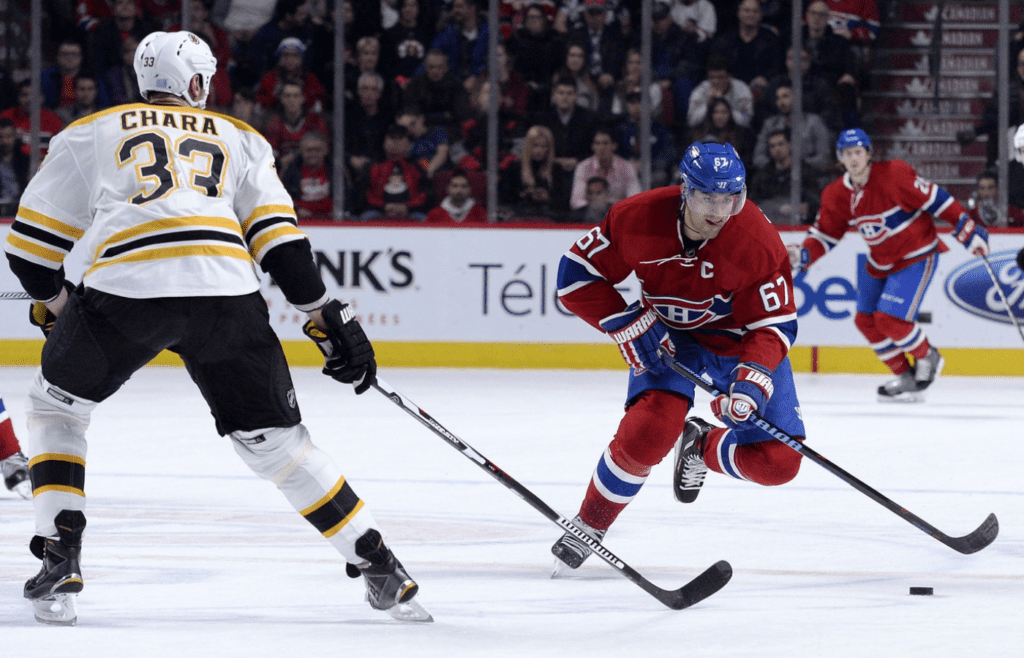 Nov 7, 2015; Montreal, Quebec, CAN; Montreal Canadiens forward Max Pacioretty (67) skates with the puck as Boston Bruins defenseman Zdeno Chara (33) defends during the third period at the Bell Centre. Mandatory Credit: Eric Bolte-Imagn Images