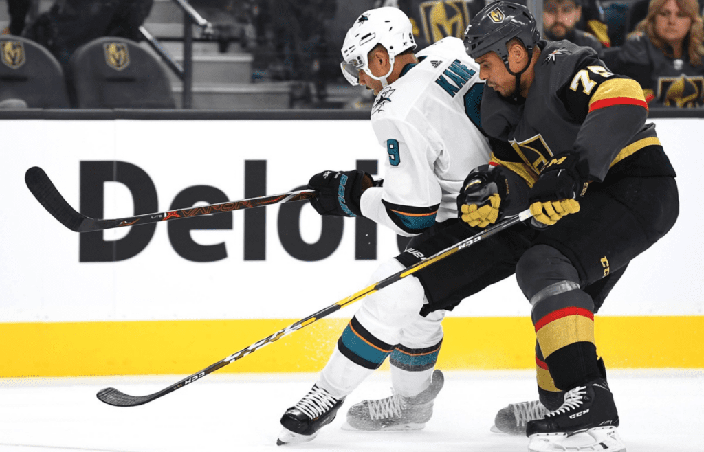 Apr 16, 2019; Las Vegas, NV, USA; Vegas Golden Knights right wing Ryan Reaves (75) checks San Jose Sharks left wing Evander Kane (9) during the second period of game four of the first round of the 2019 Stanley Cup Playoffs at T-Mobile Arena. Mandatory Credit: Stephen R. Sylvanie-Imagn Images