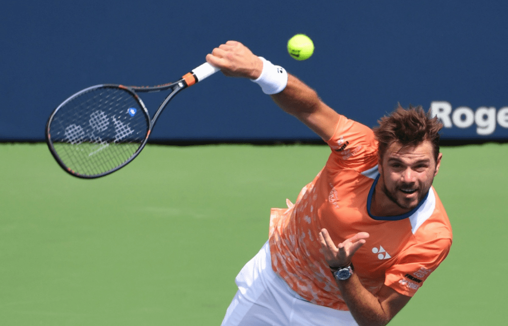 Aug 7, 2018; Toronto, Ontario, Canada; Stan Wawrinka of Switzerland serves against Nick Kyrgios of Australia (not shown) in the Rogers Cup tennis tournament at Aviva Centre. Mandatory Credit: Dan Hamilton-Imagn Images