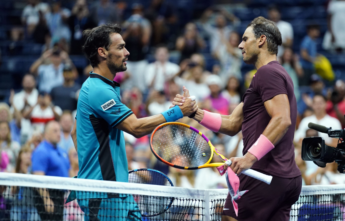 Sep 1, 2022; Flushing, NY, USA; Rafael Nadal of Spain, right, and Fabio Fognini of Italy shake hands after the match on day four of the 2022 U.S. Open tennis tournament at USTA Billie Jean King Tennis Center. Mandatory Credit: Danielle Parhizkaran-Imagn Images