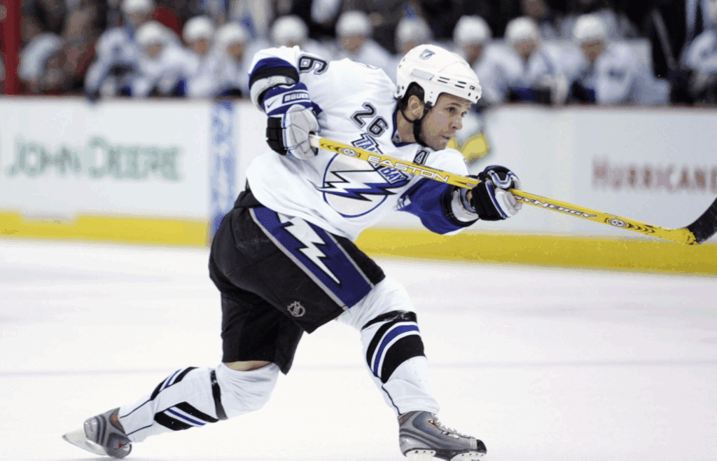 November 23, 2007; Raleigh, NC, USA; Tampa Bay Lightning right wing (26) Martin St. Louis takes a slap shot at the Carolina Hurricanes goal during the 1st period at the RBC Center in Raleigh, NC. Mandatory Credit: James Guillory-Imagn Images