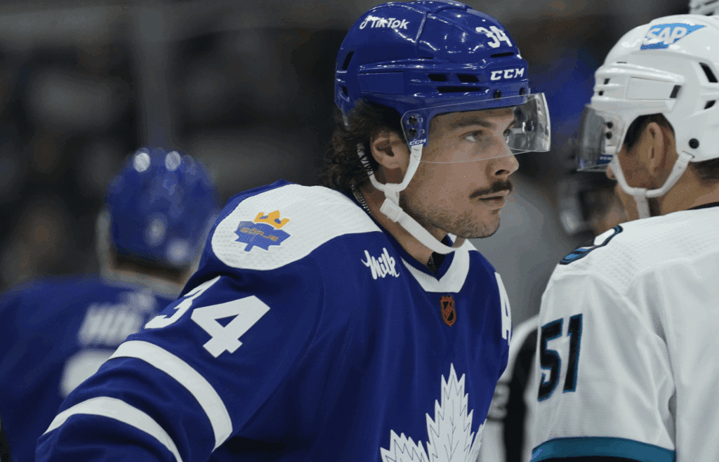 Nov 30, 2022; Toronto, Ontario, CAN;A a patch honoring the late Borje Salming is visible on the right shoulder of Toronto Maple Leafs forward Auston Matthews (34) during the third period against San Jose Sharks at Scotiabank Arena. Mandatory Credit: John E. Sokolowski-Imagn Images