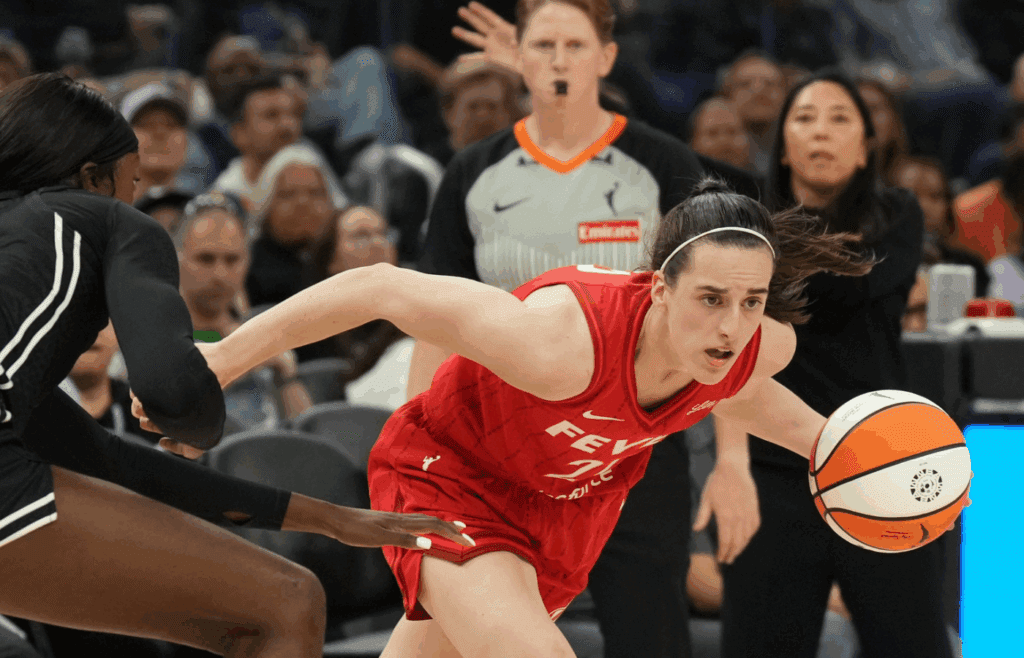 Jun 19, 2025; San Francisco, California, USA; Indiana Fever guard Caitlin Clark (right) dribbles against Golden State Valkyries forward Laeticia Amihere (left) during the third quarter at Chase Center. Mandatory Credit: Darren Yamashita-Imagn Images