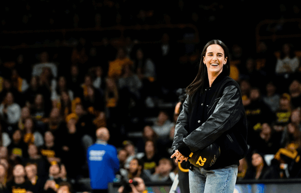 Caitlin Clark reacts during a video featuring clips submitted by fans during her jersey retirement ceremony Sunday, Feb. 2, 2025 at Carver-Hawkeye Arena in Iowa City, Iowa