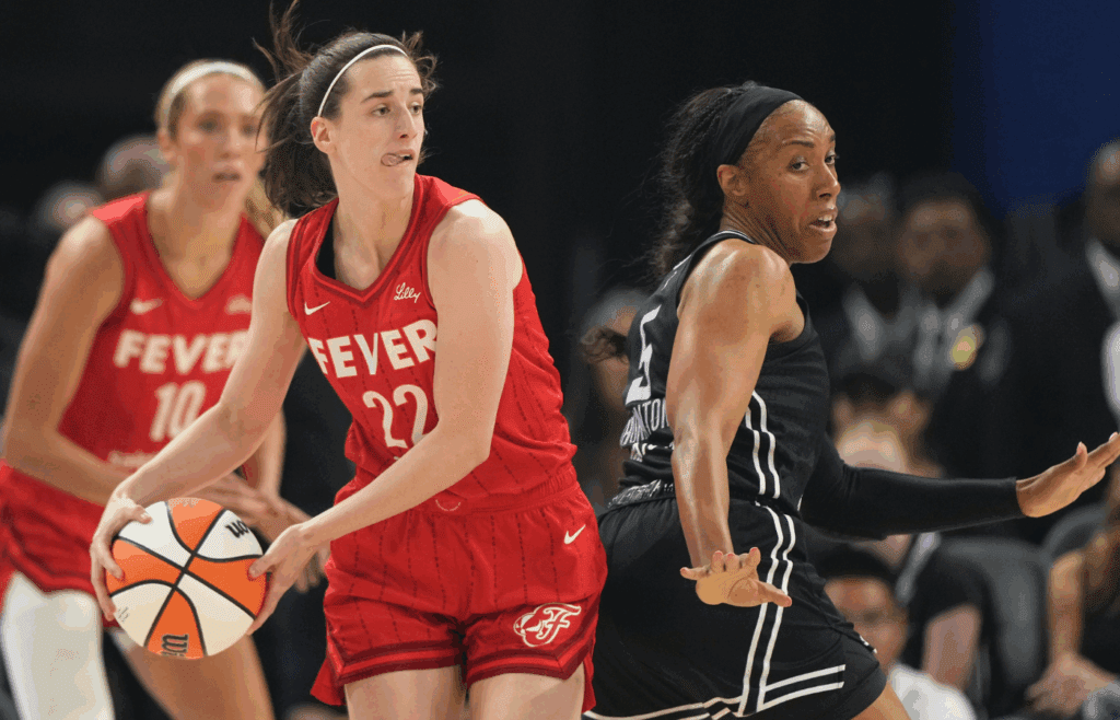 Jun 19, 2025; San Francisco, California, USA; Indiana Fever guard Caitlin Clark (22) handles the ball against Golden State Valkyries forward Kayla Thornton (5) during the first quarter at Chase Center. Mandatory Credit: Darren Yamashita-Imagn Images
