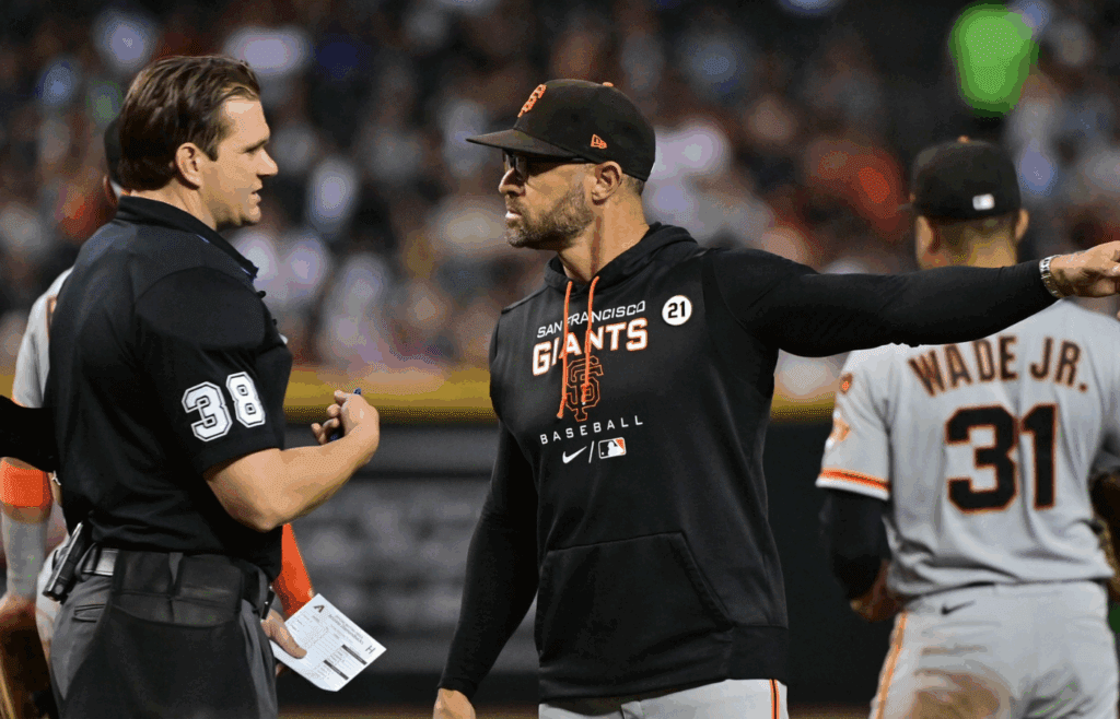 Sep 19, 2023; Phoenix, Arizona, USA; San Francisco Giants manager Gabe Kapler (19) talks with MLB umpire Adam Beck in the third inning against the Arizona Diamondbacks at Chase Field. Mandatory Credit: Matt Kartozian-Imagn Images