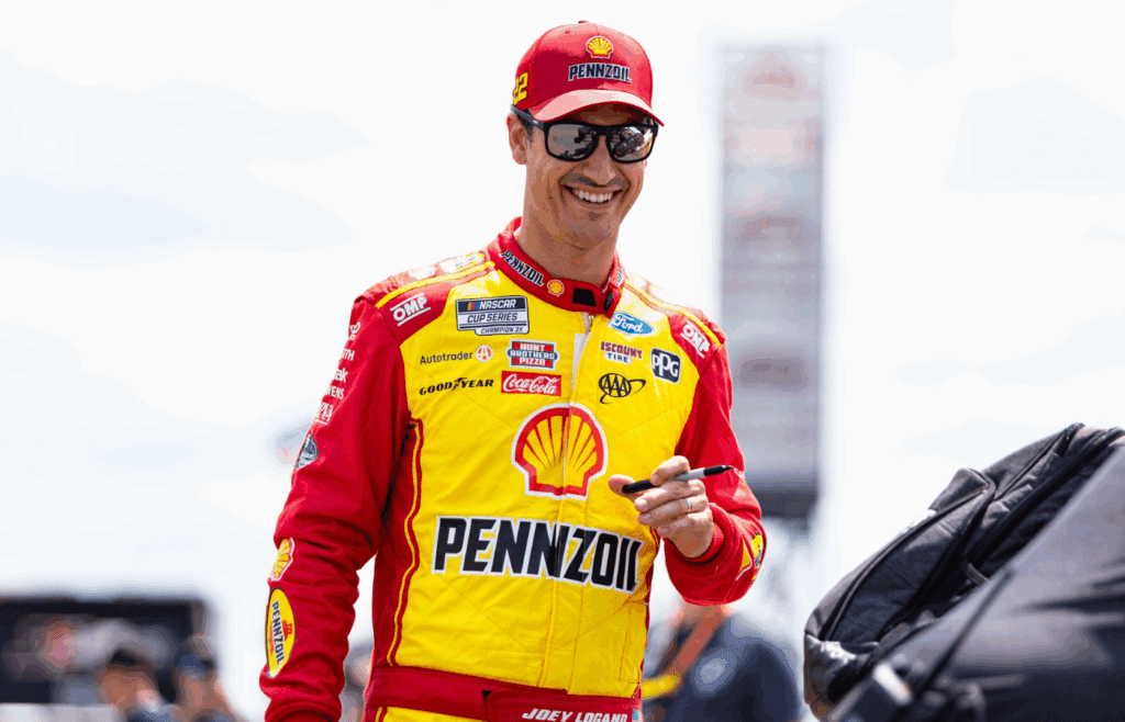 Joey Logano gives out autographs at The Great American Getaway 400 at Pocono Raceway on June 21, 2025.