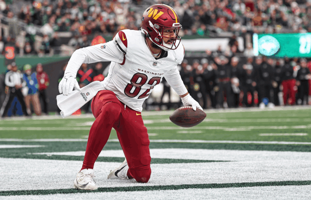 Dec 24, 2023; East Rutherford, New Jersey, USA; Washington Commanders tight end Logan Thomas (82) reacts after a touchdown reception during the second half against the New York Jets at MetLife Stadium. Mandatory Credit: Vincent Carchietta-Imagn Images