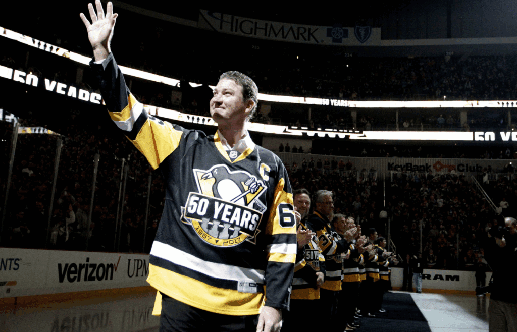 Dec 3, 2016; Pittsburgh, PA, USA; Pittsburgh Penguins owner and former center Mario Lemieux (66) waves to the crowd as the Penguins celebrate the 1991-92 Stanley Cup Championship team before playing the Detroit Red Wings at the PPG PAINTS Arena. Mandatory Credit: Charles LeClaire-Imagn Images