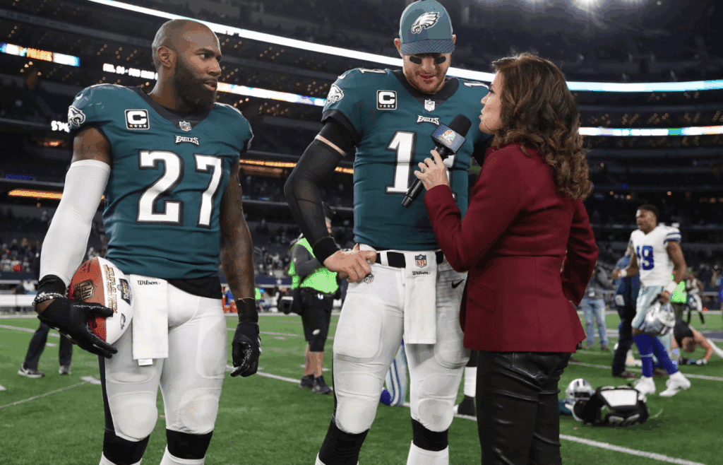 Nov 19, 2017; Arlington, TX, USA; Philadelphia Eagles quarterback Carson Wentz (11) and safety Malcolm Jenkins (27) are interviewed by NBC reporter Michele Tafoya after a victory against the Dallas Cowboys at AT&T Stadium. Mandatory Credit: Matthew Emmons-Imagn Images