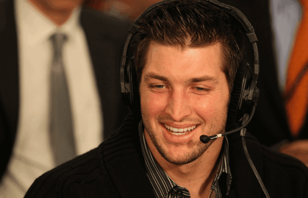 Feb 2, 2012; Indianapolis, IN, USA; Denver Broncos quarterback Tim Tebow gives an interview on radio row for Super Bowl week. The New York Giants will play the New England Patriots in Super Bowl XLVI . Mandatory Credit: Matthew Emmons-Imagn Images