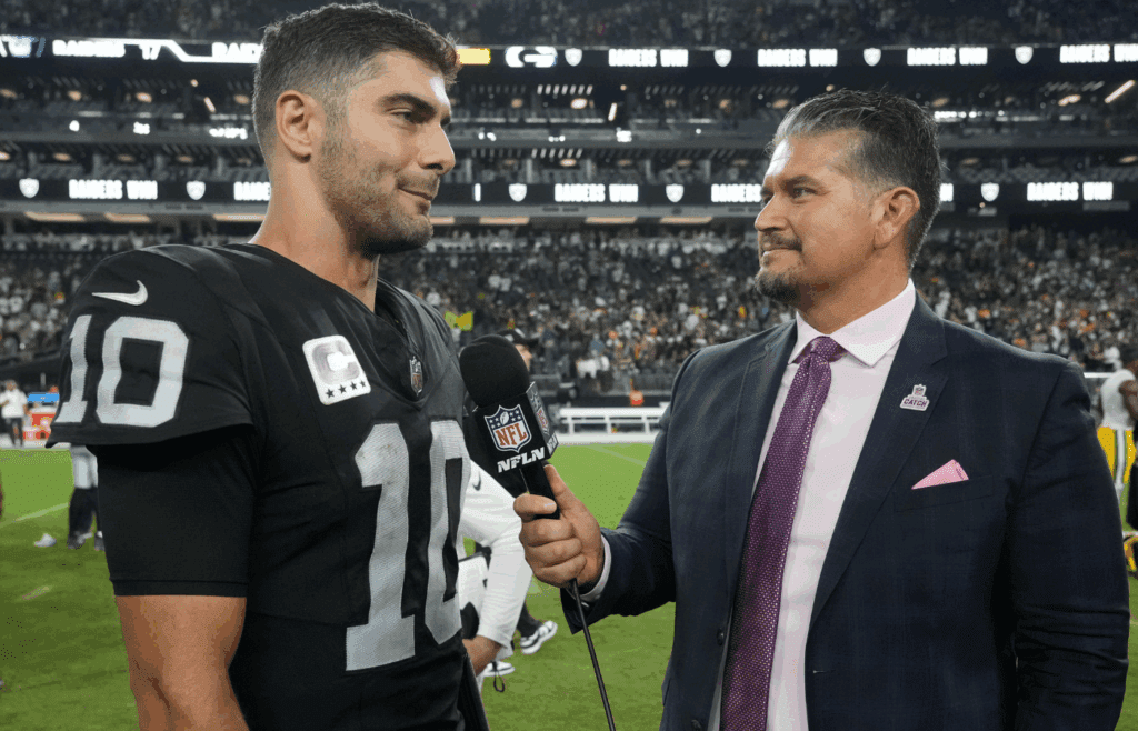 Oct 9, 2023; Paradise, Nevada, USA; Las Vegas Raiders quarterback Jimmy Garoppolo (10) is interviewed by NFL Network reporter Omar Ruiz after the game against the Green Bay Packers at Allegiant Stadium. Mandatory Credit: Kirby Lee-Imagn Images