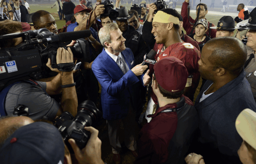Nov 2, 2013; Tallahassee, FL, USA; Florida State Seminoles quarterback Jameis Winston (5) does a end of game interview with ESPN after defeating the Miami Hurricanes 41-14 at Doak Campbell Stadium. Mandatory Credit: John David Mercer-Imagn Images