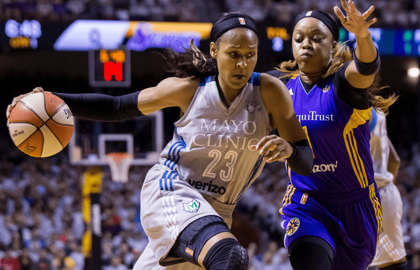 Oct 4, 2017; Minneapolis, MN, USA; Minnesota Lynx forward Maya Moore (23) dribbles in the first quarter against the Los Angeles Sparks guard Odyssey Sims (1) in Game 5 of the WNBA Finals at Williams Arena. Mandatory Credit: Brad Rempel-Imagn Images