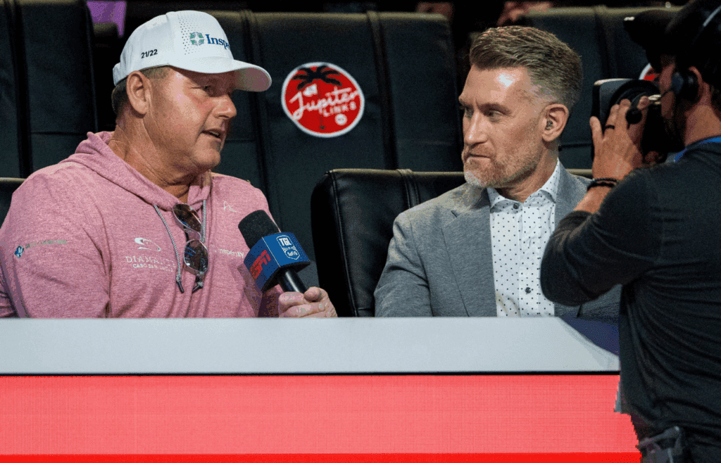 Baseball legend Roger Clemens is interviewed by ESPN's Marty Smith during a TGL match between Jupiter Links GC and Atlanta Drive GC at SoFi Center on March 4, 2025, in Palm Beach Gardens, Florida