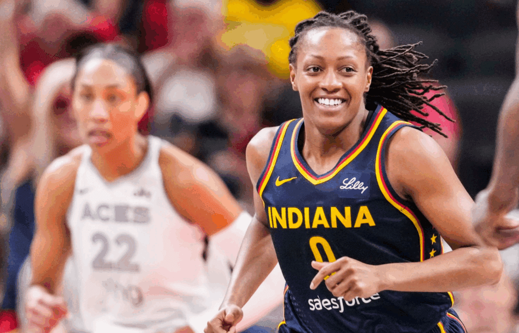 Indiana Fever guard Kelsey Mitchell (0) smiles after a play Thursday, July 3, 2025, during a game between the Indiana Fever and the Las Vegas Aces at Gainbridge Fieldhouse in Indianapolis.