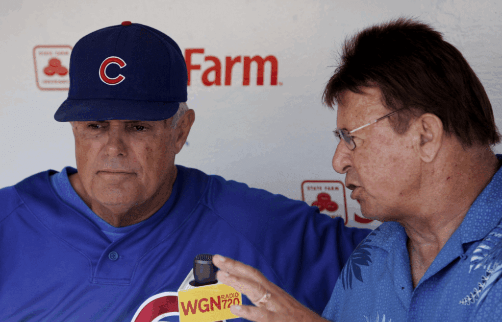 Aug 22, 2010; Chicago, IL, USA; Chicago Cubs manager Lou Piniella (left) is interviewed by former third baseman Ron Santo before the game against the Atlanta Braves at Wrigley Field. Mandatory Credit: Jerry Lai-Imagn Images