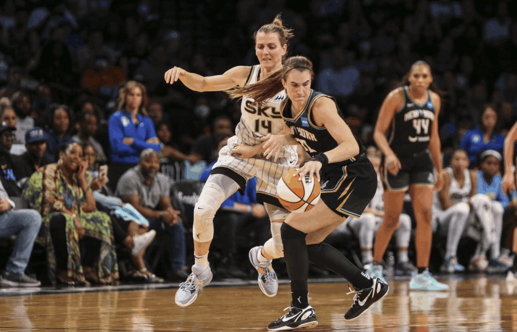 Aug 23, 2022; Brooklyn, New York, USA; New York Liberty guard Sabrina Ionescu (20) spins away from Chicago Sky guard Allie Quigley (14) in the third quarter at Barclays Center. Mandatory Credit: Wendell Cruz-Imagn Images