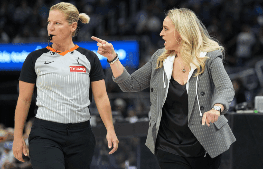 Jun 7, 2025; San Francisco, California, USA; Las Vegas Aces head coach Becky Hammon (right) yells at referee Teresa Stuck (left) during the third quarter against the Golden State Valkyries at Chase Center. Mandatory Credit: Darren Yamashita-Imagn Images