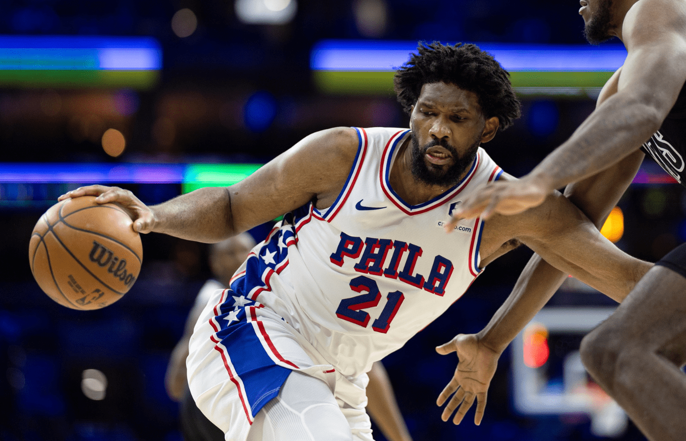 Feb 22, 2025; Philadelphia, Pennsylvania, USA; Philadelphia 76ers center Joel Embiid (21) controls the ball against Brooklyn Nets center Day'Ron Sharpe (20) during the third quarter at Wells Fargo Center. Mandatory Credit: Bill Streicher-Imagn Images