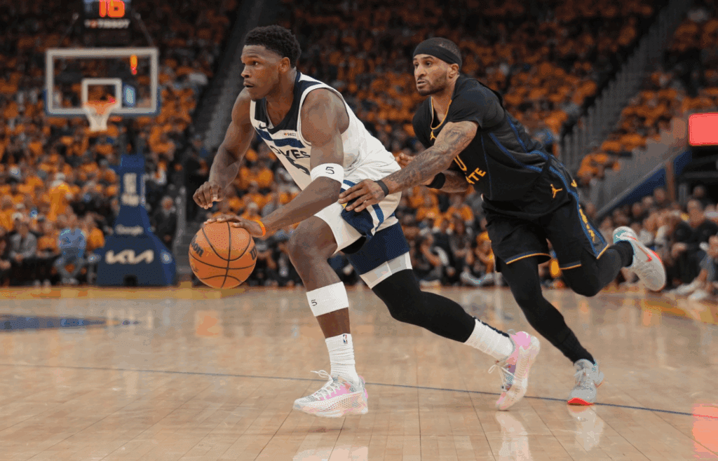May 12, 2025; San Francisco, California, USA; Minnesota Timberwolves guard Anthony Edwards (5) dribbles past Golden State Warriors guard Gary Payton II (0) in the second quarter during game four of the second round for the 2025 NBA Playoffs at Chase Center. Mandatory Credit: Cary Edmondson-Imagn Images