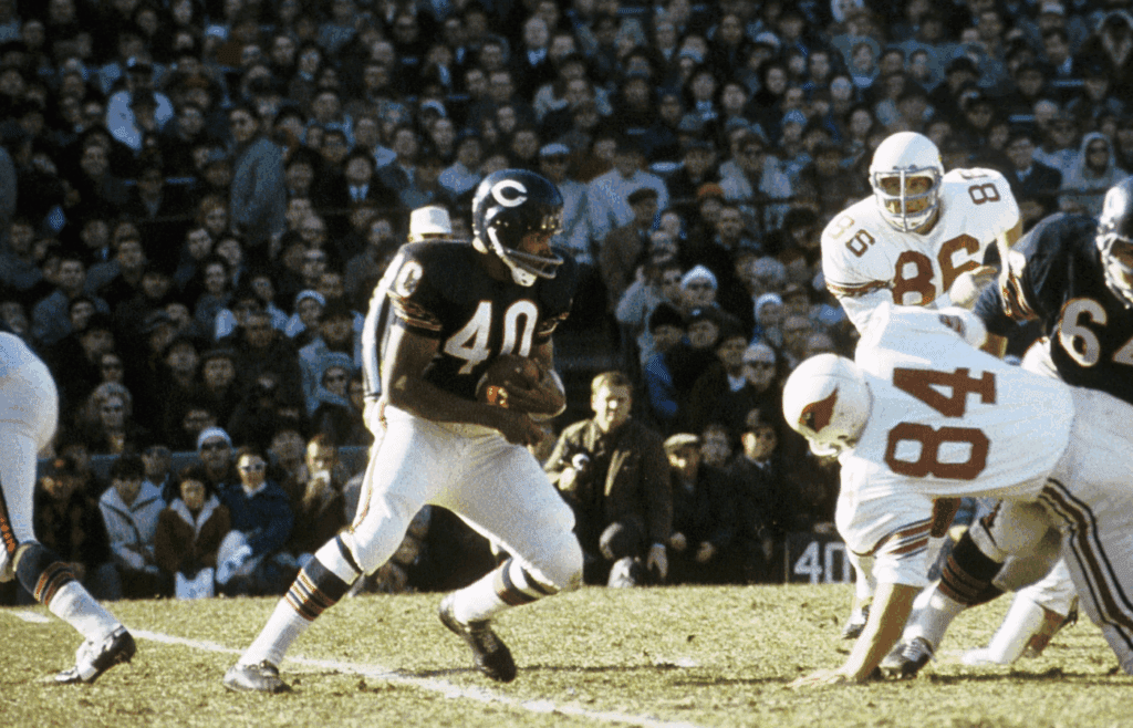 Nov 14,1965: Chicago, IL, USA FILE PHOTO; Chicago Bears running back Gale Sayers (40) carries the ball against the St. Louis Cardinals at Wrigley Field. Mandatory Credit Herb Weitman-Imagn Images
