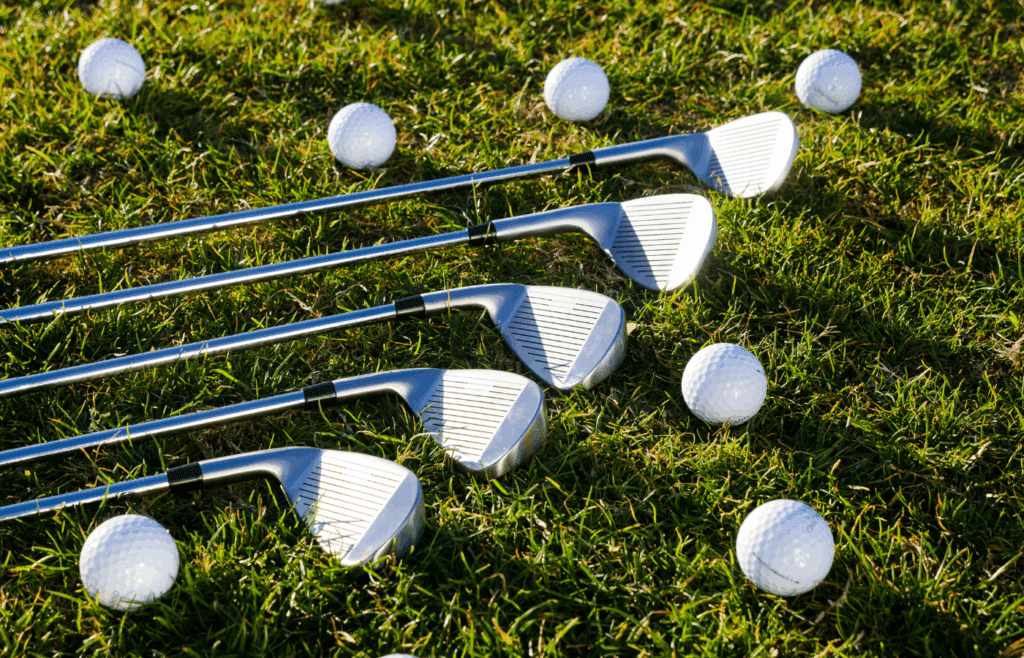 Five Golf Clubs and Golf Balls