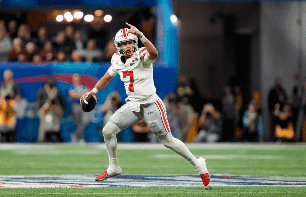 Dec 31, 2022; Atlanta, Georgia, USA; Ohio State Buckeyes quarterback C.J. Stroud (7) runs away from the pocket to throw a touchdown pass to Ohio State Buckeyes wide receiver Marvin Harrison Jr. (18), not in photo, against Georgia Bulldogs during the first quarter of the Peach Bowl in the College Football Playoff semifinal at Mercedes-Benz Stadium. Osu22uga Kwr 16 Syndication The Columbus Dispatch