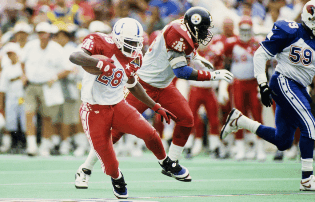 Feb 5, 1995; Honolulu, HI, USA; FILE PHOTO; Indianapolis Colts running back Marshall Faulk (28) carries the ball during the 1995 Pro Bowl at Aloha Stadium. During this game Faulk rushed for a record setting 180 yards. Mandatory Credit: RVR Photos-Imagn Images