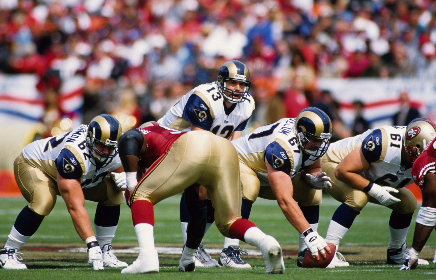 Sep 23, 2001; San Francisco, CA, USA; FILE PHOTO; St. Louis Rams quarterback Kurt Warner (13) and offensive linemen Adam Timmerman (62), Andy McCollum (67) and Tom Nutten (61) at the line of scrimmage against the San Francisco 49ers at Candlestick Park. Mandatory Credit: Peter Brouillet-USA TODAY NETWORK